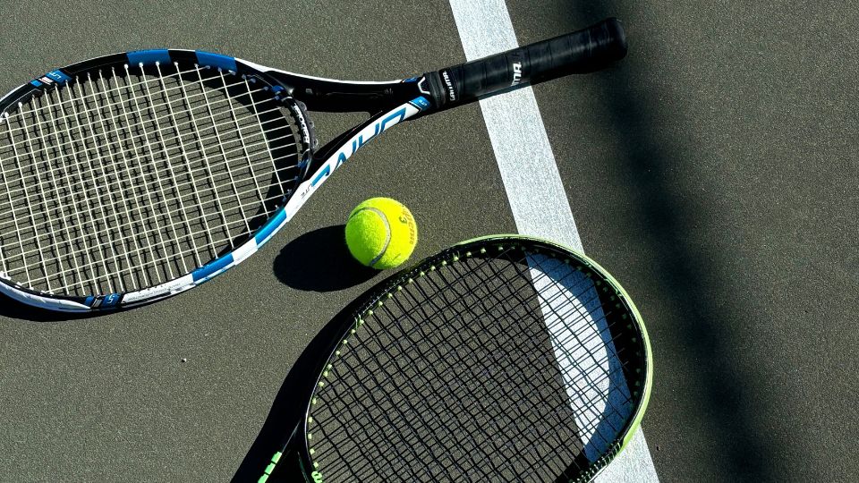 Tennis rackets on floor with a tennis ball - Dig & Dig