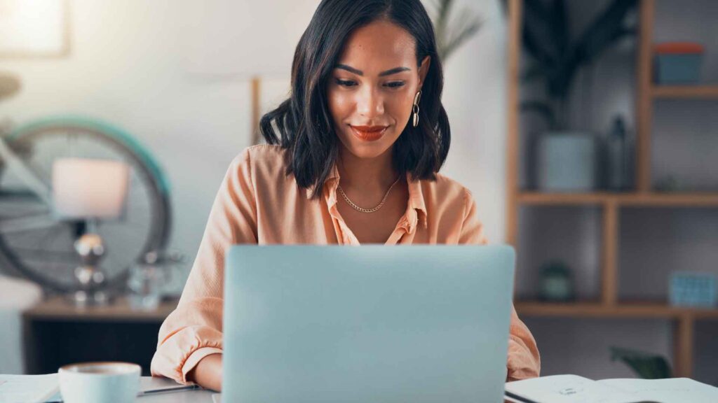 Woman on laptop analysing backlink profile for SEO - Dig & Dig