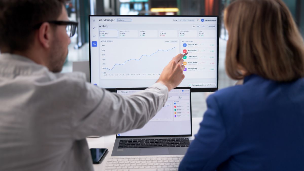 Two agency workers analysing paid social and programmatic B2B media strategy - Dig & Dig